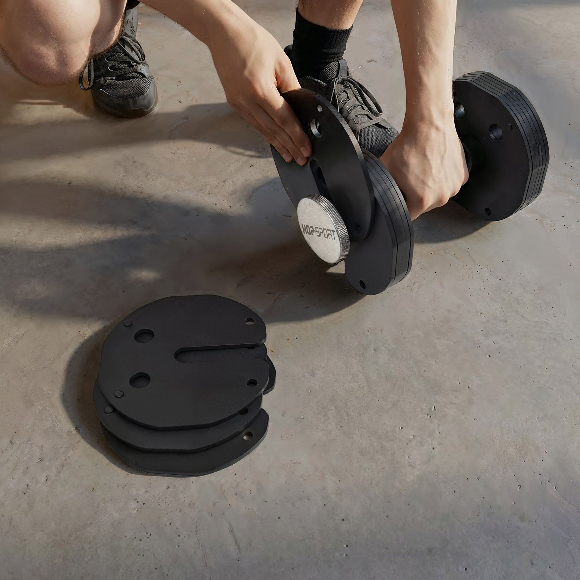 Différentes configurations de poids de 4 kg à 30 kg avec l'haltère modulable en fonte.