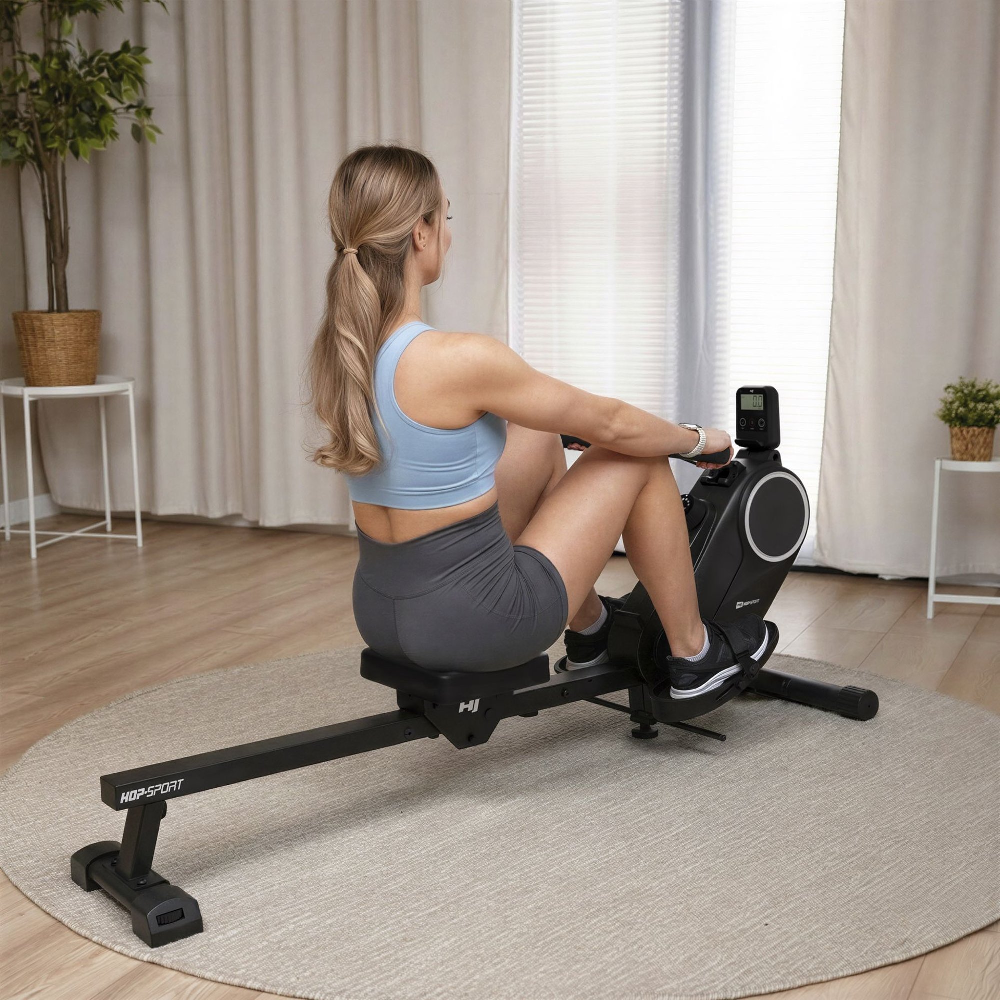 Rameur magnétique Creek pliable pour fitness à domicile, design robuste noir et gris.