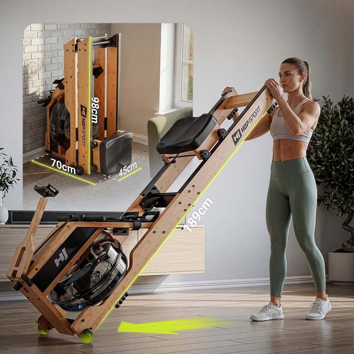 Rameur pliable en bambou avec roulettes pour rangement vertical.