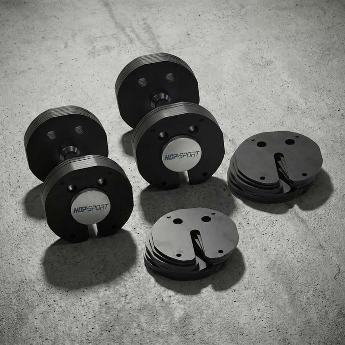 Haltère compact au design moderne avec extrémités plates pour un gain de place en home gym.