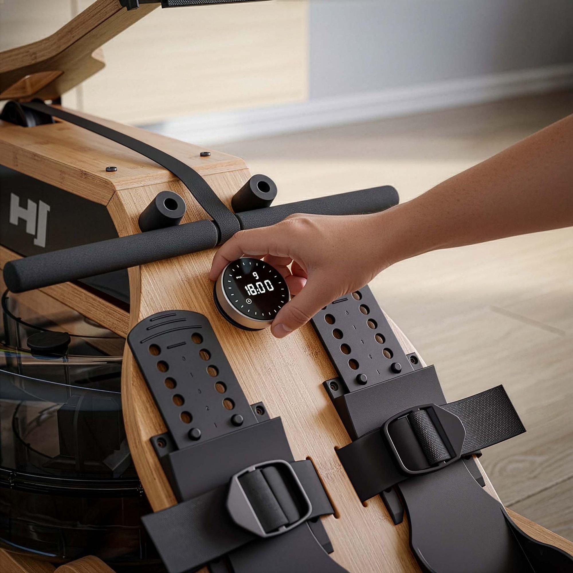 Console d'entraînement avec support smartphone et application Kinomap du rameur.